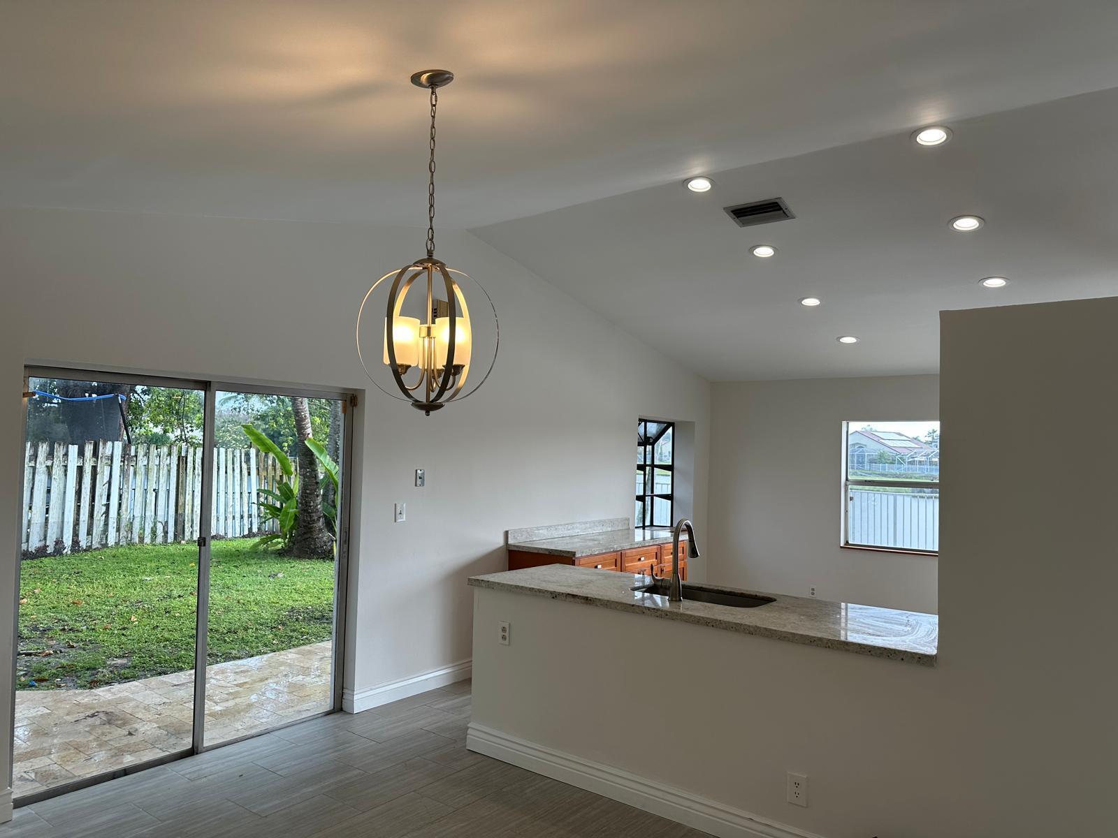 9841 Ridge Creek Road Boca Raton, FL 33496 - Photo 23 of 24 a view of a living room and window