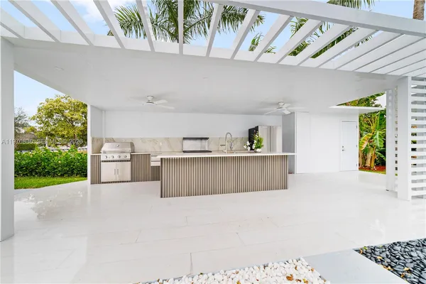 a view of kitchen with furniture and natural light