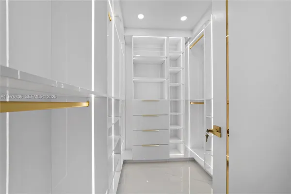 a bathroom with a double vanity sink toilet mirror and shower