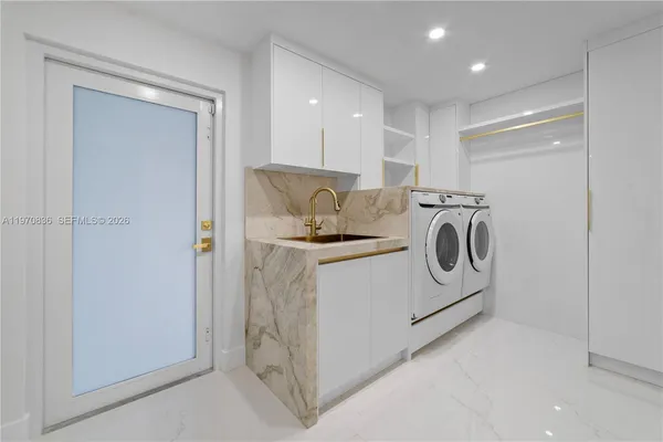 a bathroom with a granite countertop sink a toilet a mirror and shower