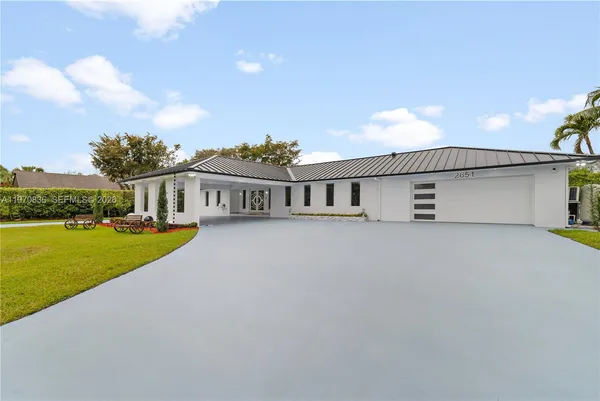 front view of a house with a yard