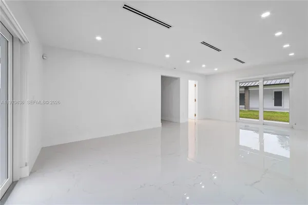 a view of an empty room with a window