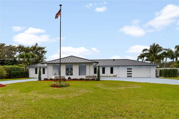a front view of house with swimming pool