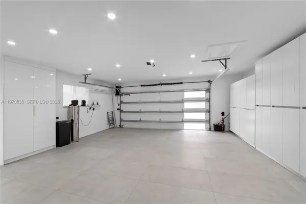 a view of an empty room with a kitchen