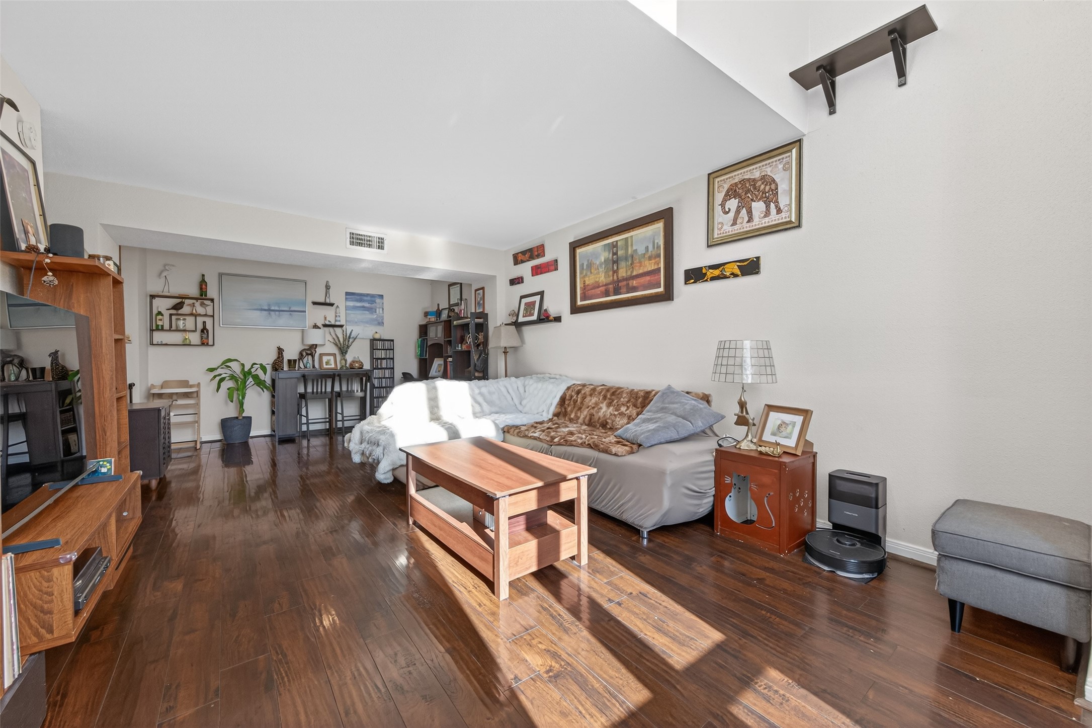 16120 Stuebner Airline Road, Unit 602 Spring, TX 77379 - Photo 16 of 50 a living room with furniture and a wooden floor