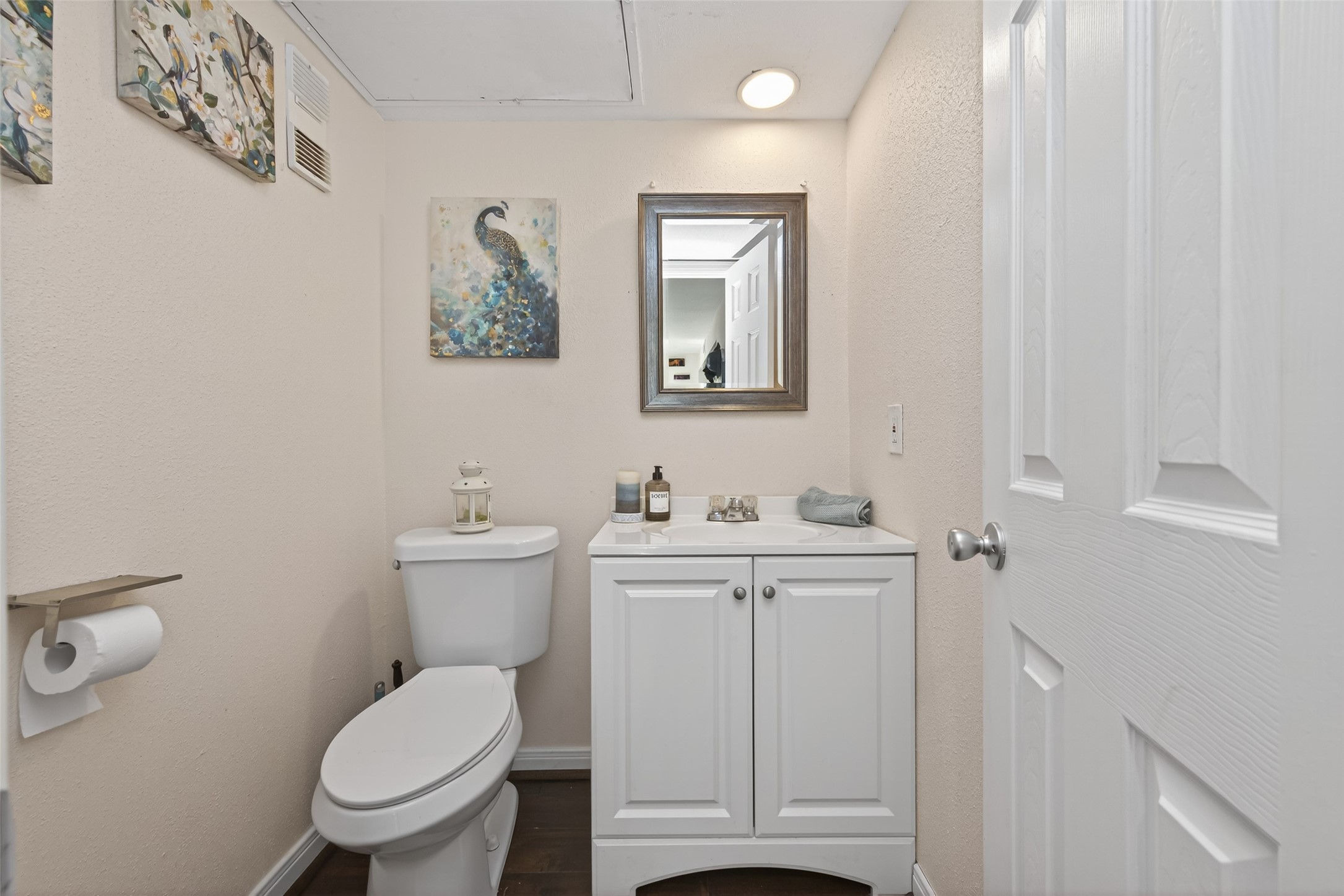 16120 Stuebner Airline Road, Unit 602 Spring, TX 77379 - Photo 28 of 50 a bathroom with a toilet a sink and mirror