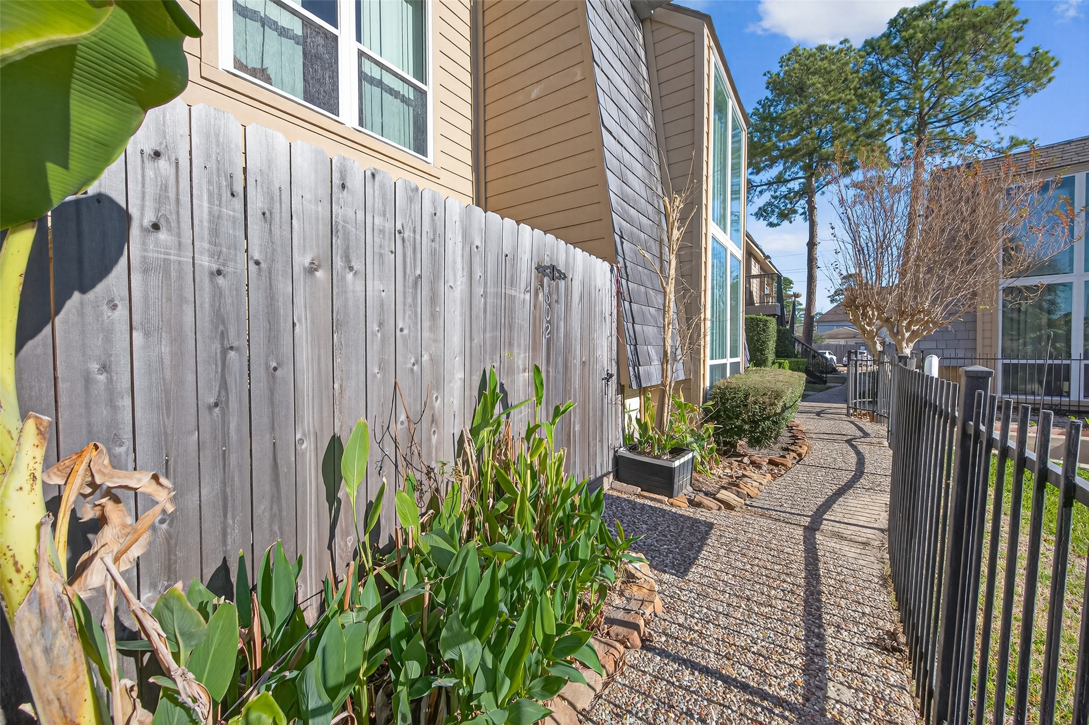 16120 Stuebner Airline Road, Unit 602 Spring, TX 77379 - Photo 3 of 50 a view of a backyard with potted plants