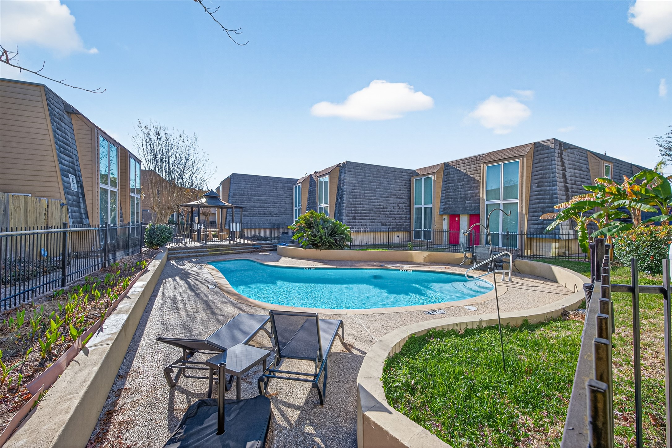 16120 Stuebner Airline Road, Unit 602 Spring, TX 77379 - Photo 43 of 50 a view of a house with swimming pool and a yard