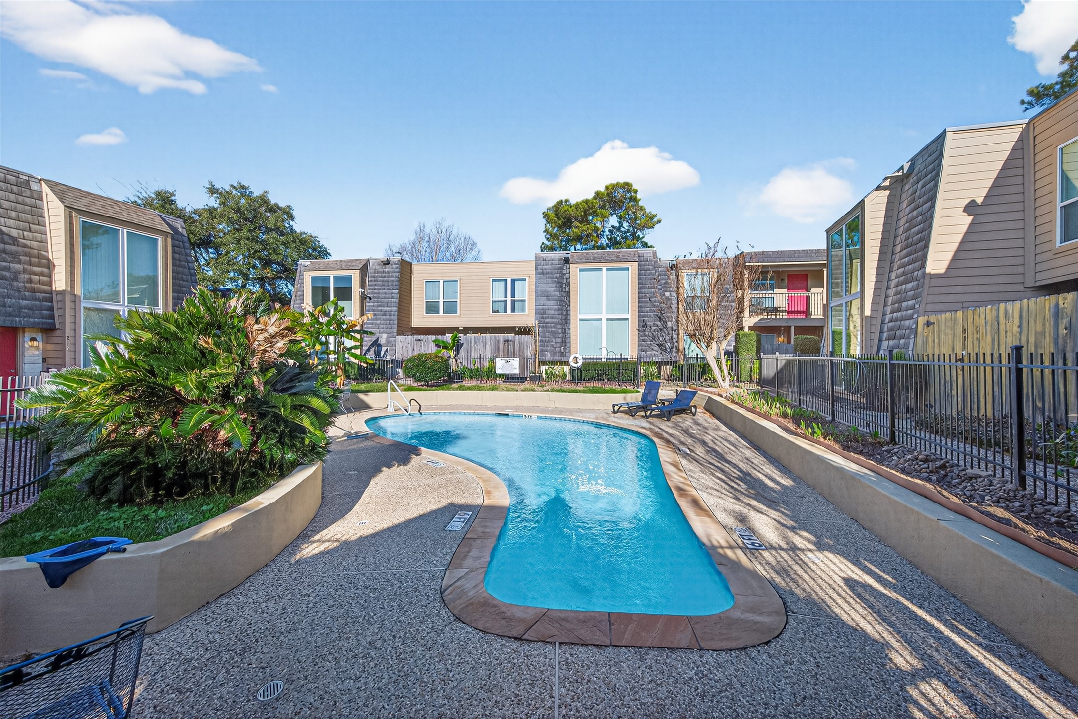 16120 Stuebner Airline Road, Unit 602 Spring, TX 77379 - Photo 47 of 50 a view of a house with a swimming pool
