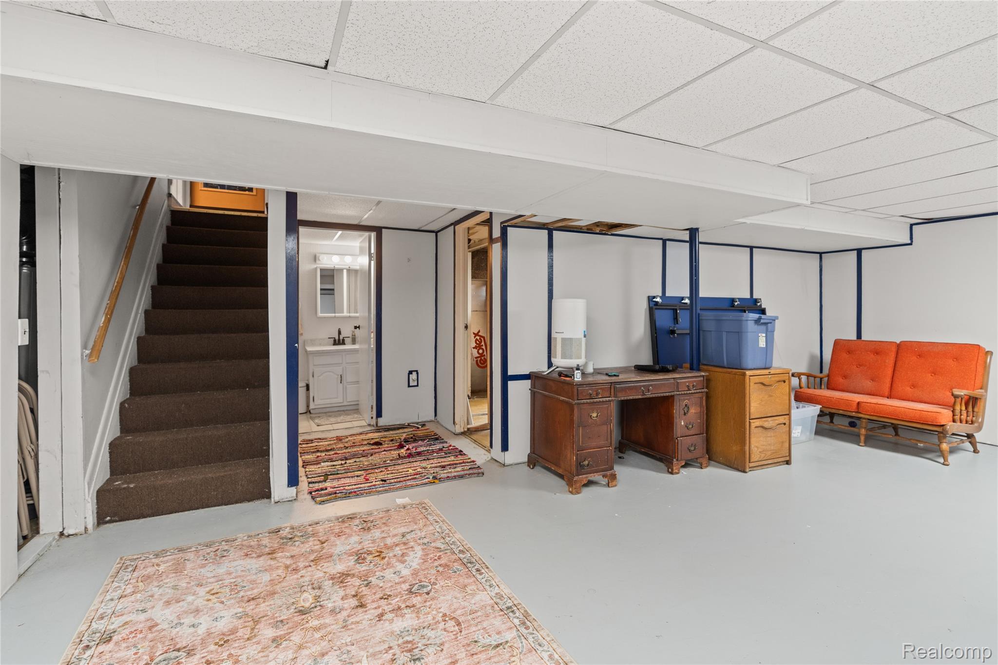 6076 East Carpenter Road Flint, MI 48506 - Photo 46 of 67 Finished basement featuring stairway and a drop ceiling