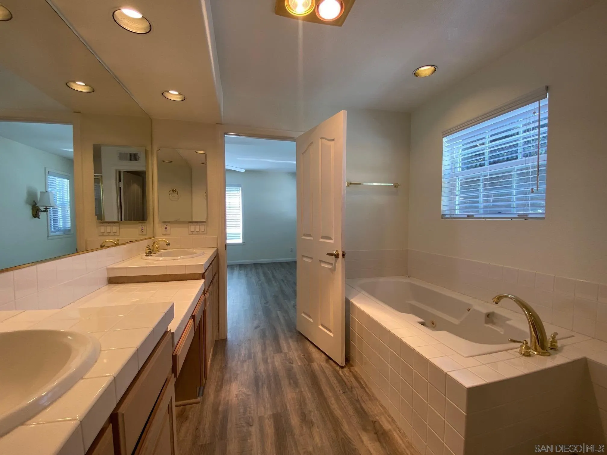 2848 Torrey Pines Road La Jolla, CA 92037 - Photo 19 of 19 a bathroom with a tub double vanity sink and mirror