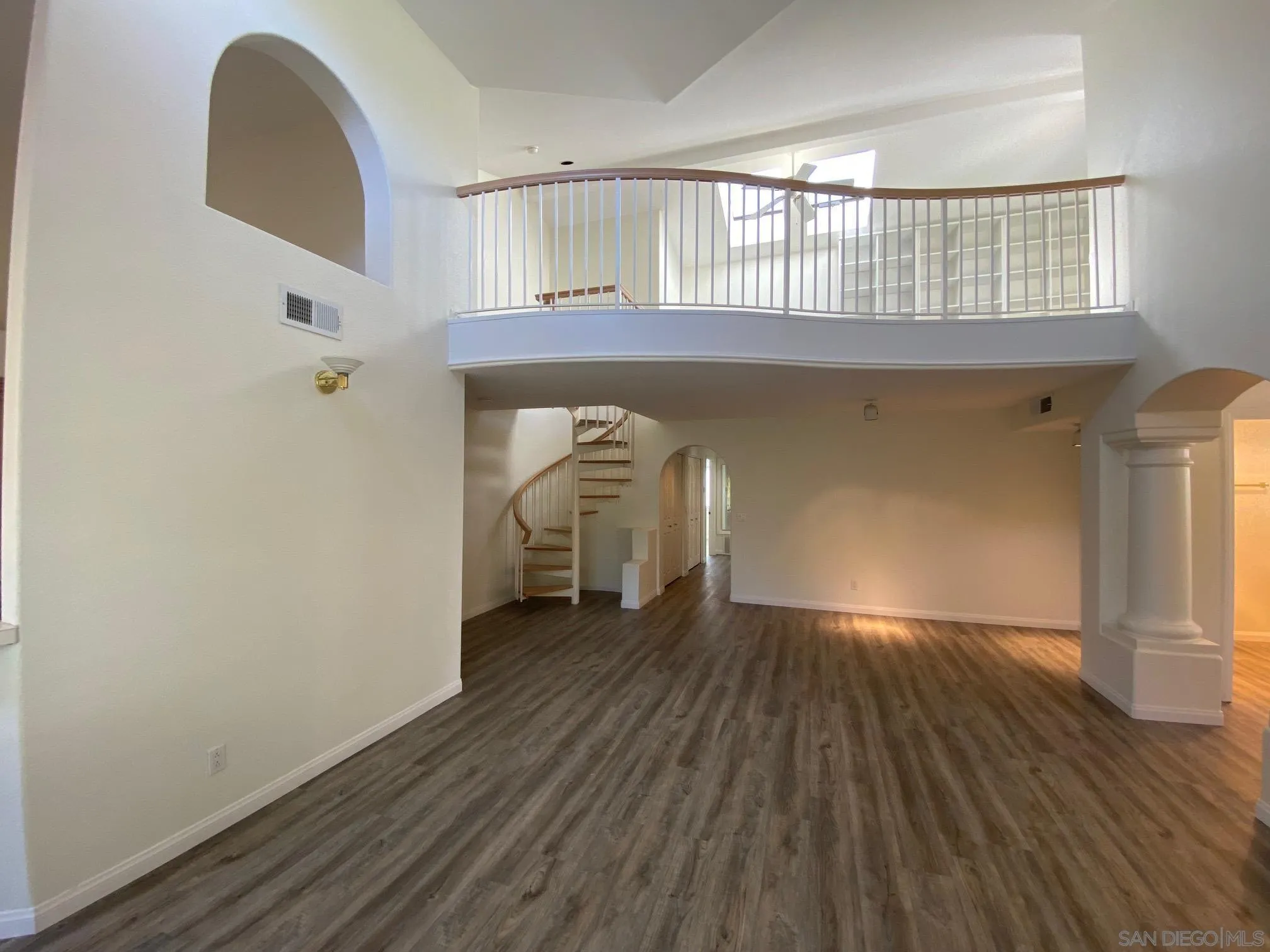 2848 Torrey Pines Road La Jolla, CA 92037 - Photo 6 of 19 a view of an empty room with wooden floor and a window