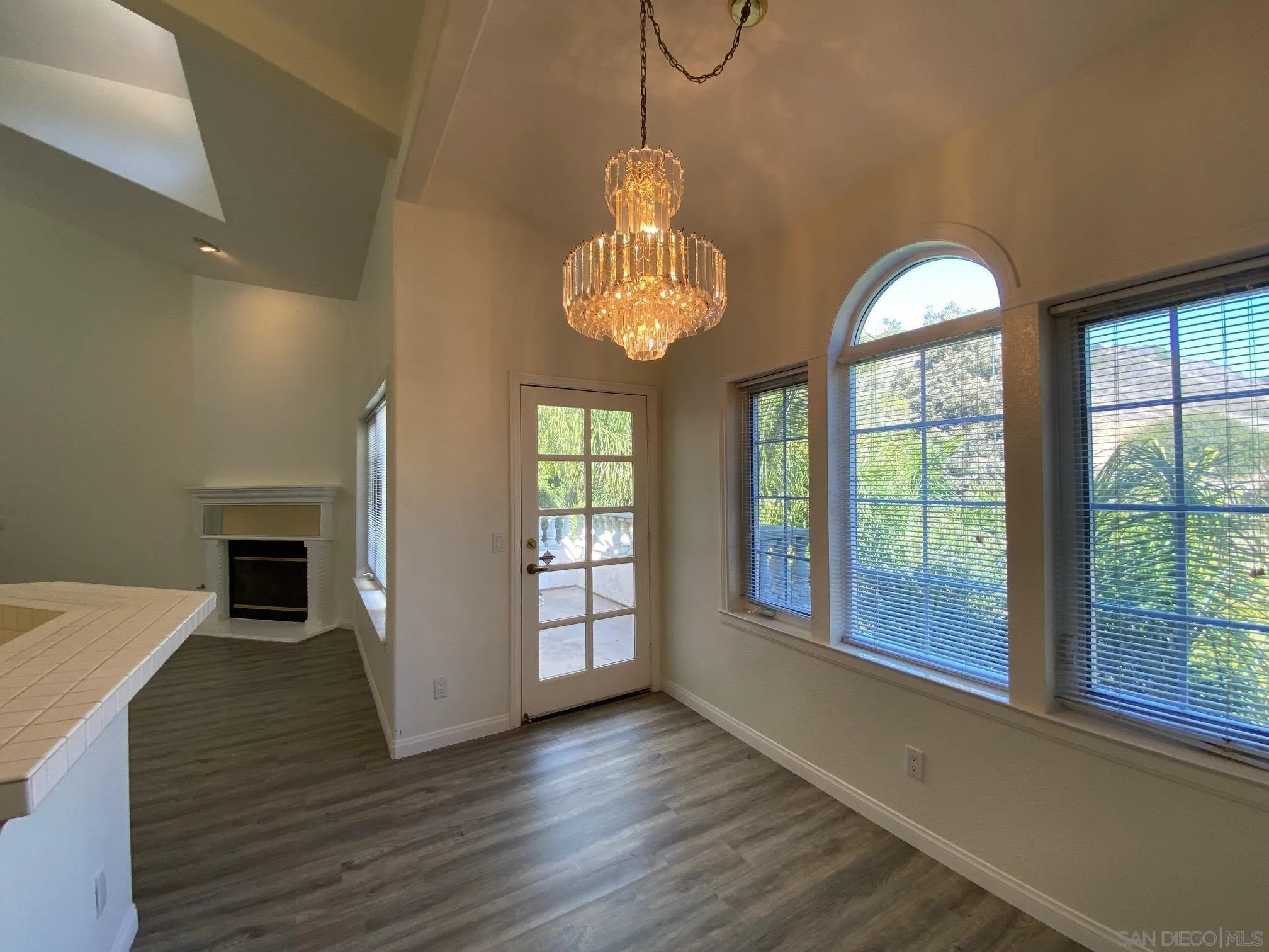 2848 Torrey Pines Road La Jolla, CA 92037 - Photo 7 of 19 a view of a room with wooden floor fireplace and windows