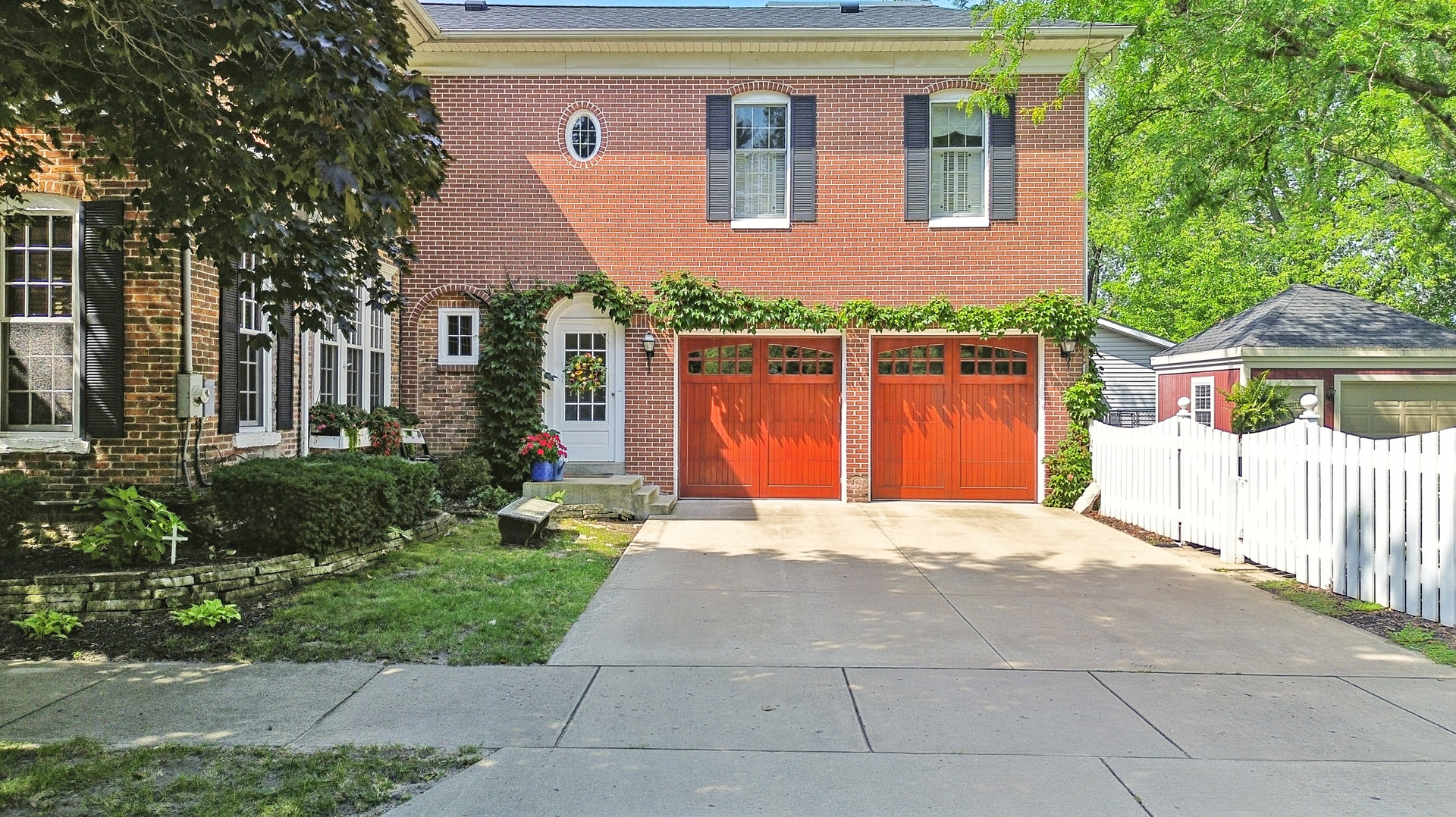 223 East Boyd Street Dixon, IL 61021 - Photo 61 of 74 a front view of a house with a yard and potted plants