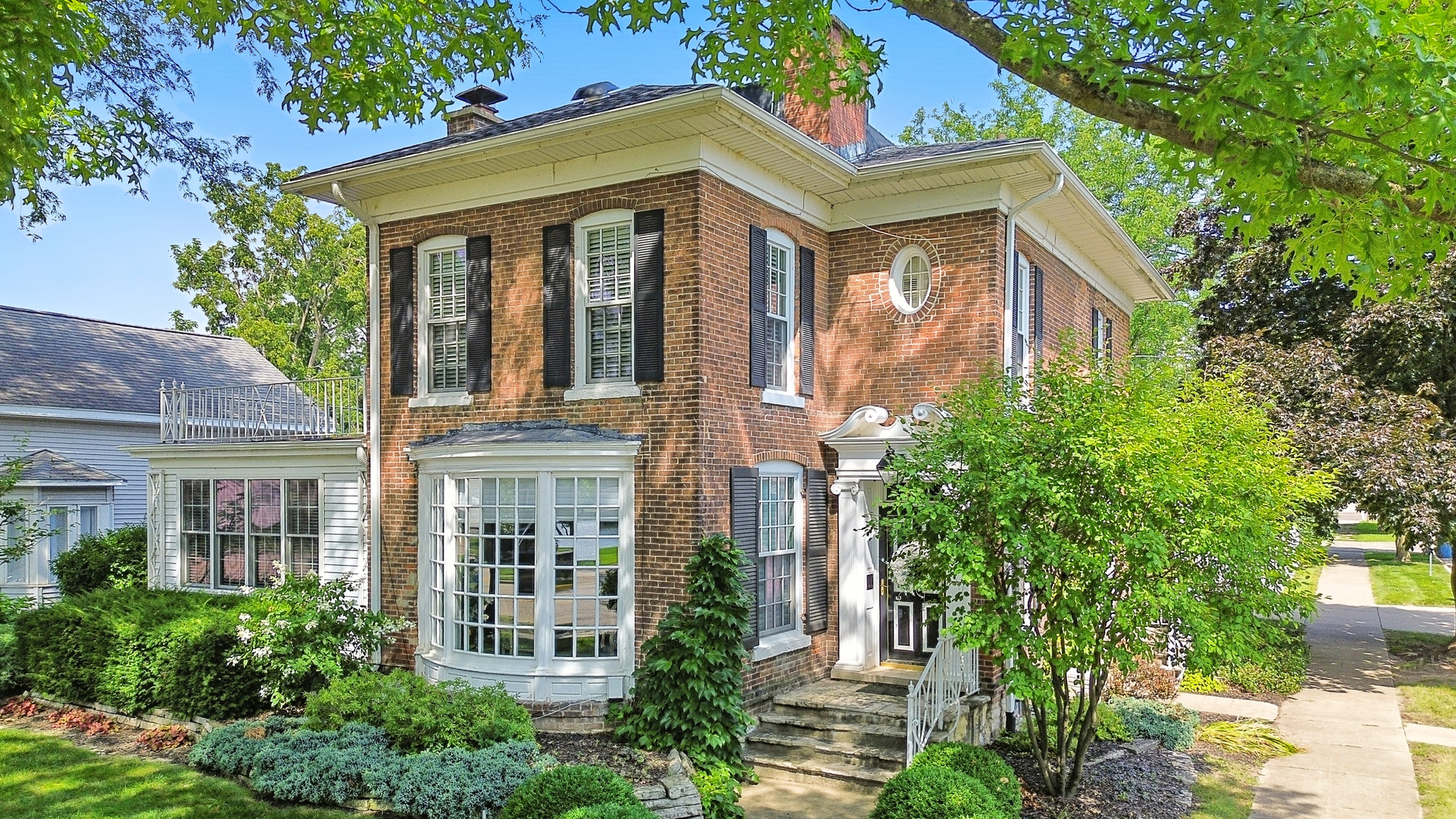 223 East Boyd Street Dixon, IL 61021 - Photo 68 of 74 a view of a white house next to a yard