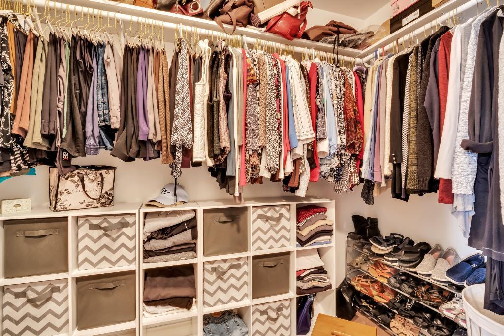 807 Sharp Court Elburn, IL 60119 - Photo 23 of 44 a view of walk in closet with clothes and shoes