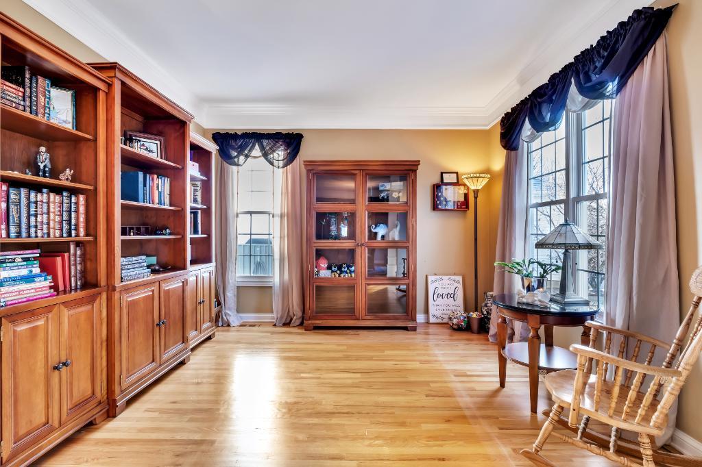807 Sharp Court Elburn, IL 60119 - Photo 6 of 44 a living room with furniture and a book shelf