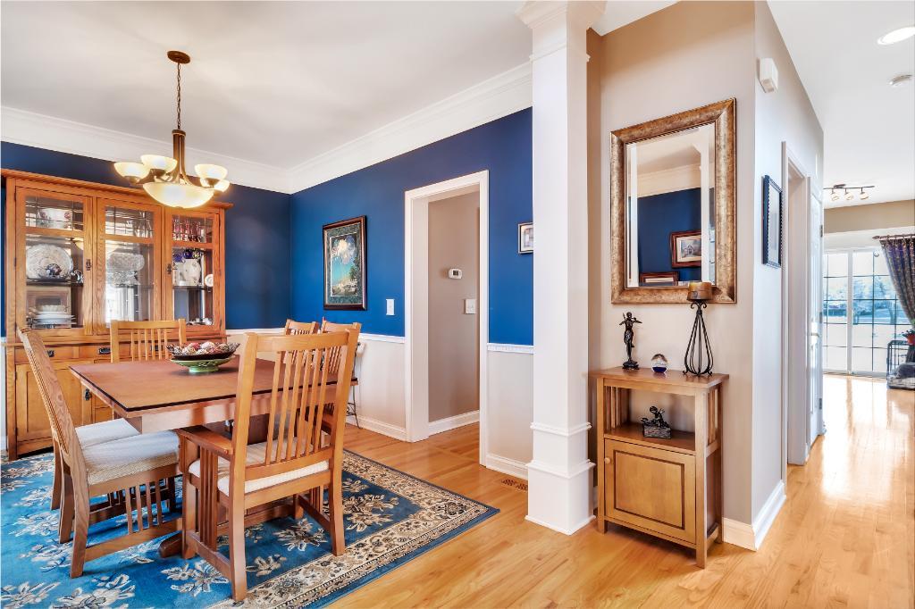 807 Sharp Court Elburn, IL 60119 - Photo 8 of 44 a dining room with furniture a chandelier and wooden floor