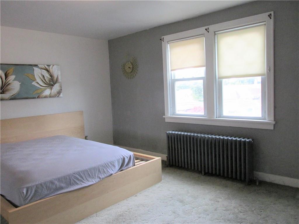 3245 Middletown Road Pittsburgh, PA 15204 - Photo 11 of 24 a bedroom with a bed and window