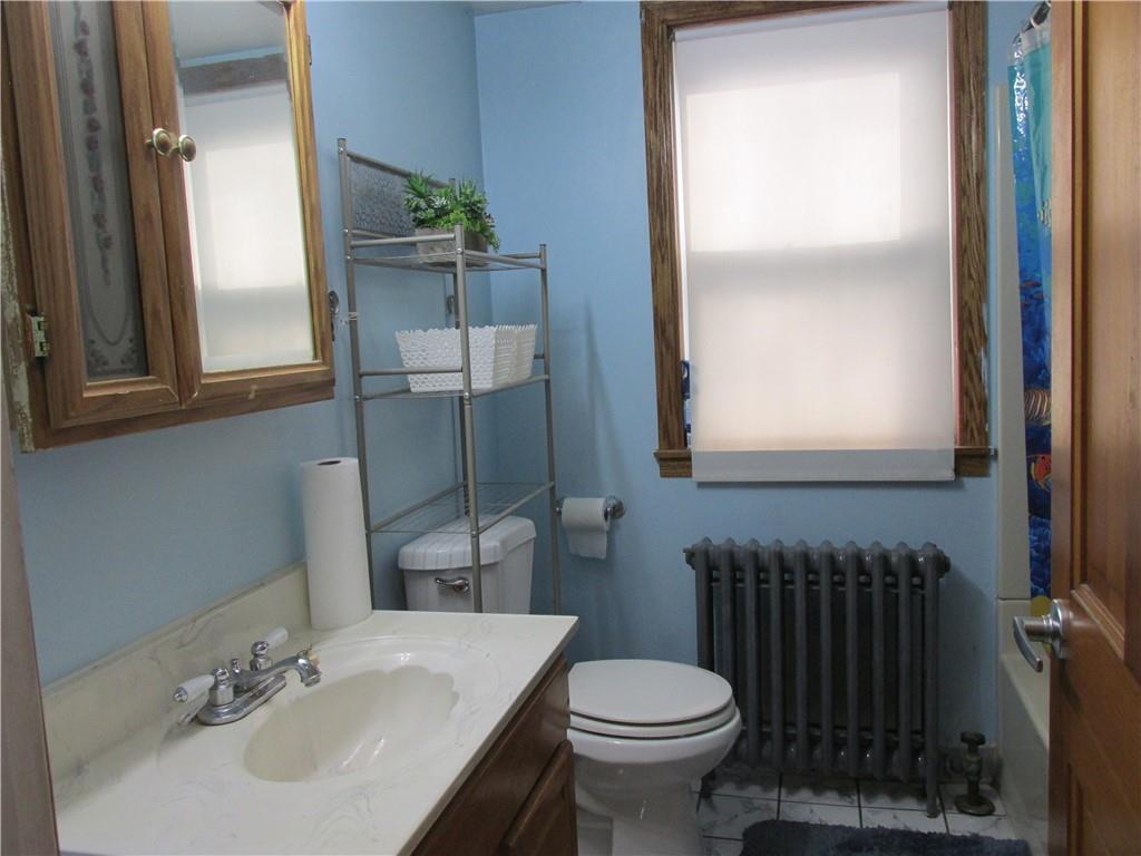 3245 Middletown Road Pittsburgh, PA 15204 - Photo 15 of 24 a bathroom with a sink toilet and mirror
