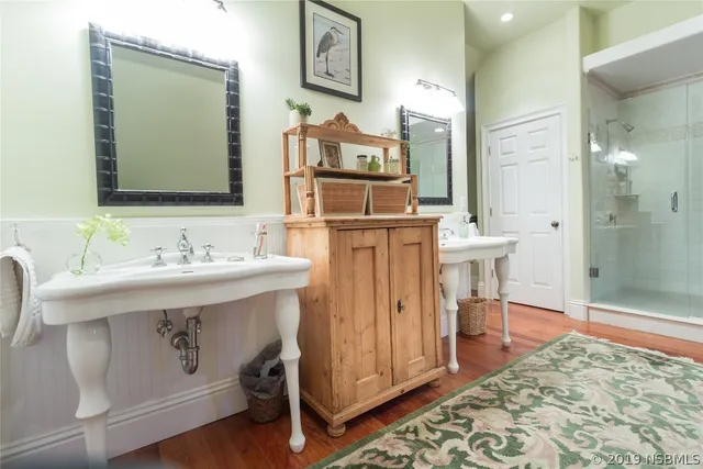 a spacious bathroom with a sink vanity and a mirror