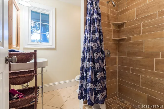 a bathroom with a bathtub and shower