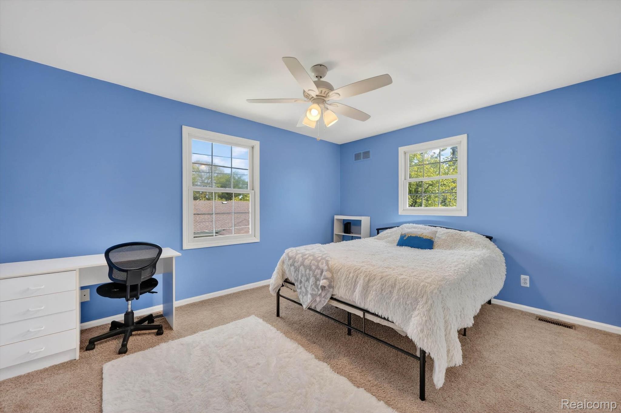 1112 Vernier Road Grosse Pointe, MI 48236 - Photo 19 of 39 Bedroom with ceiling fan, carpet, multiple windows, and an office area