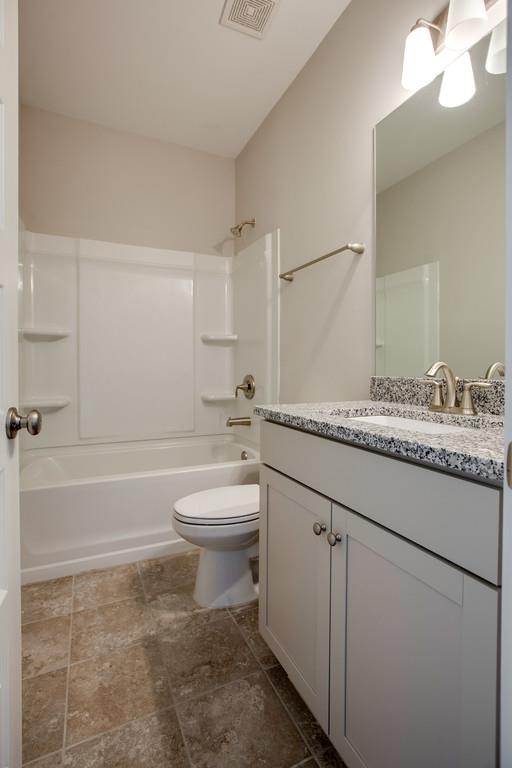 204 Sable Lane Spring Hill, TN 37174 - Photo 14 of 24 Bath 3 downstairs will have quartz countertops. Photo is of same plan in a different community.