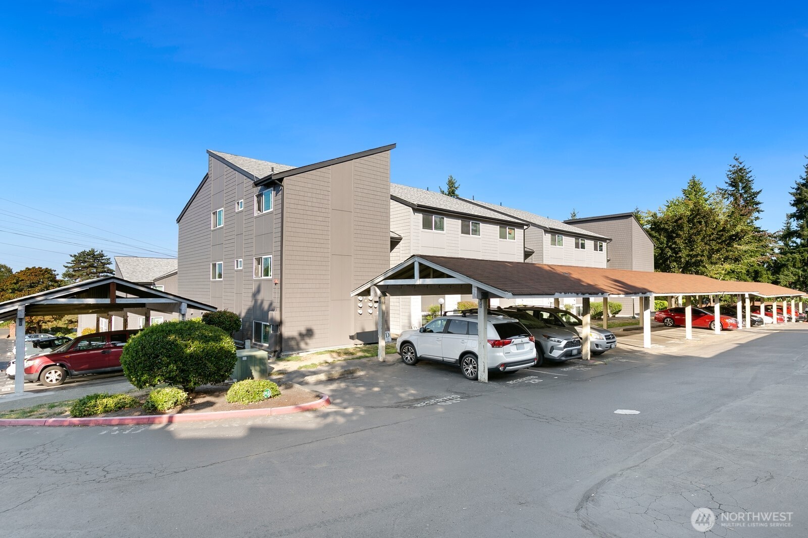 2020 Grant Avenue South, Unit D204 Renton, WA 98055 - Photo 1 of 16 a car parked in front of a building