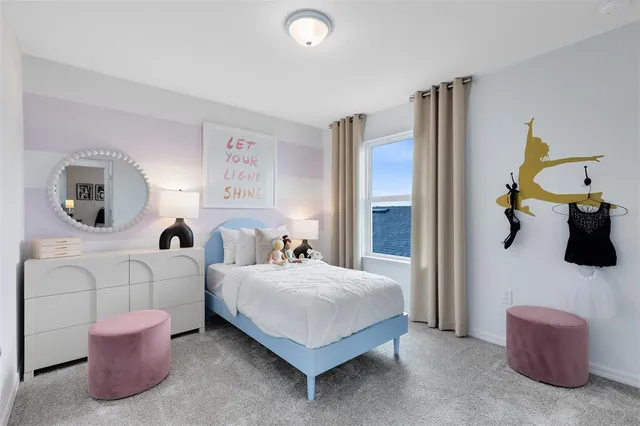 a bedroom with bed and a couch