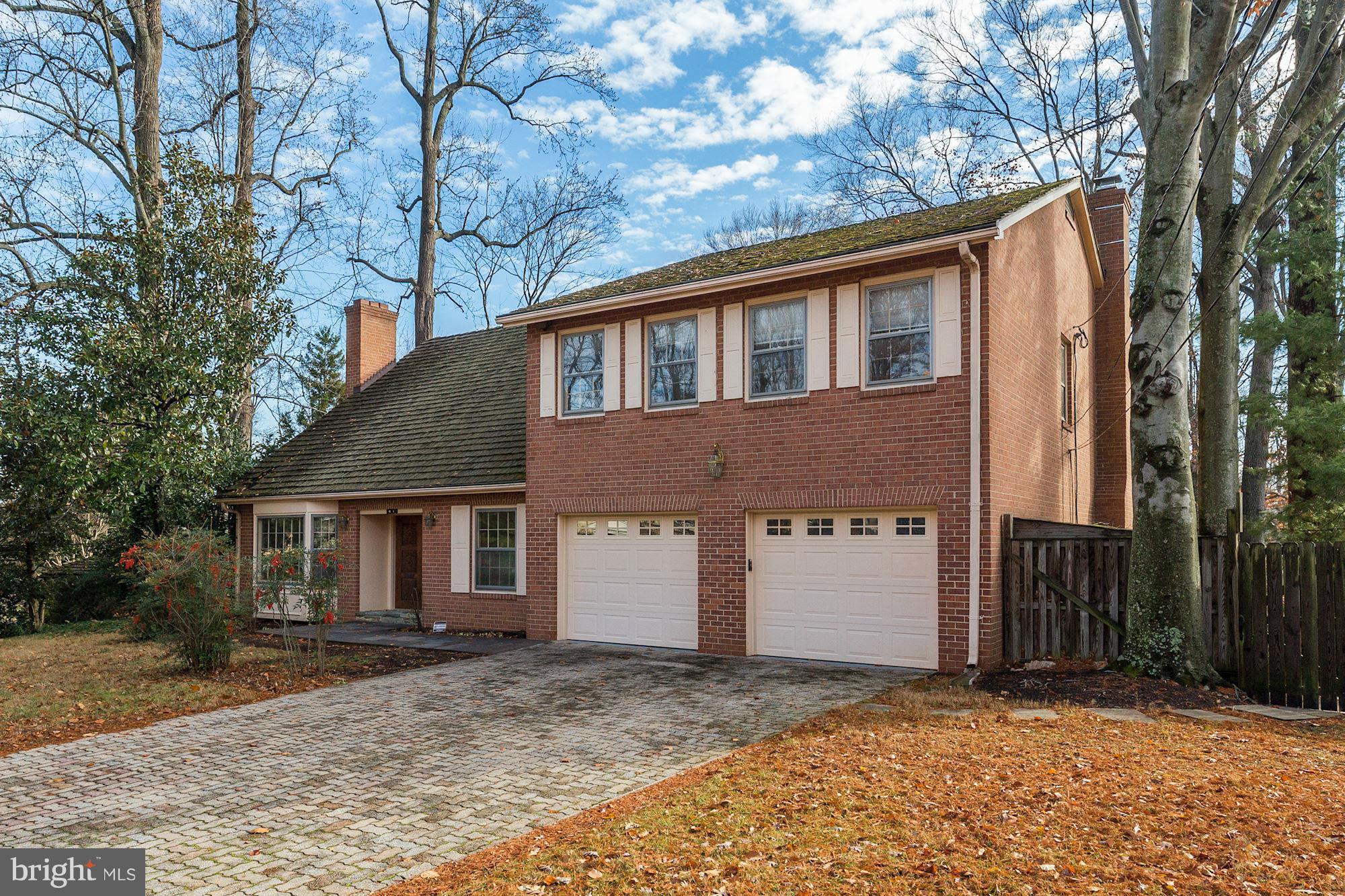 6308 Lenox Road Bethesda, MD 20817 - Photo 2 of 30 a front view of a house with a yard