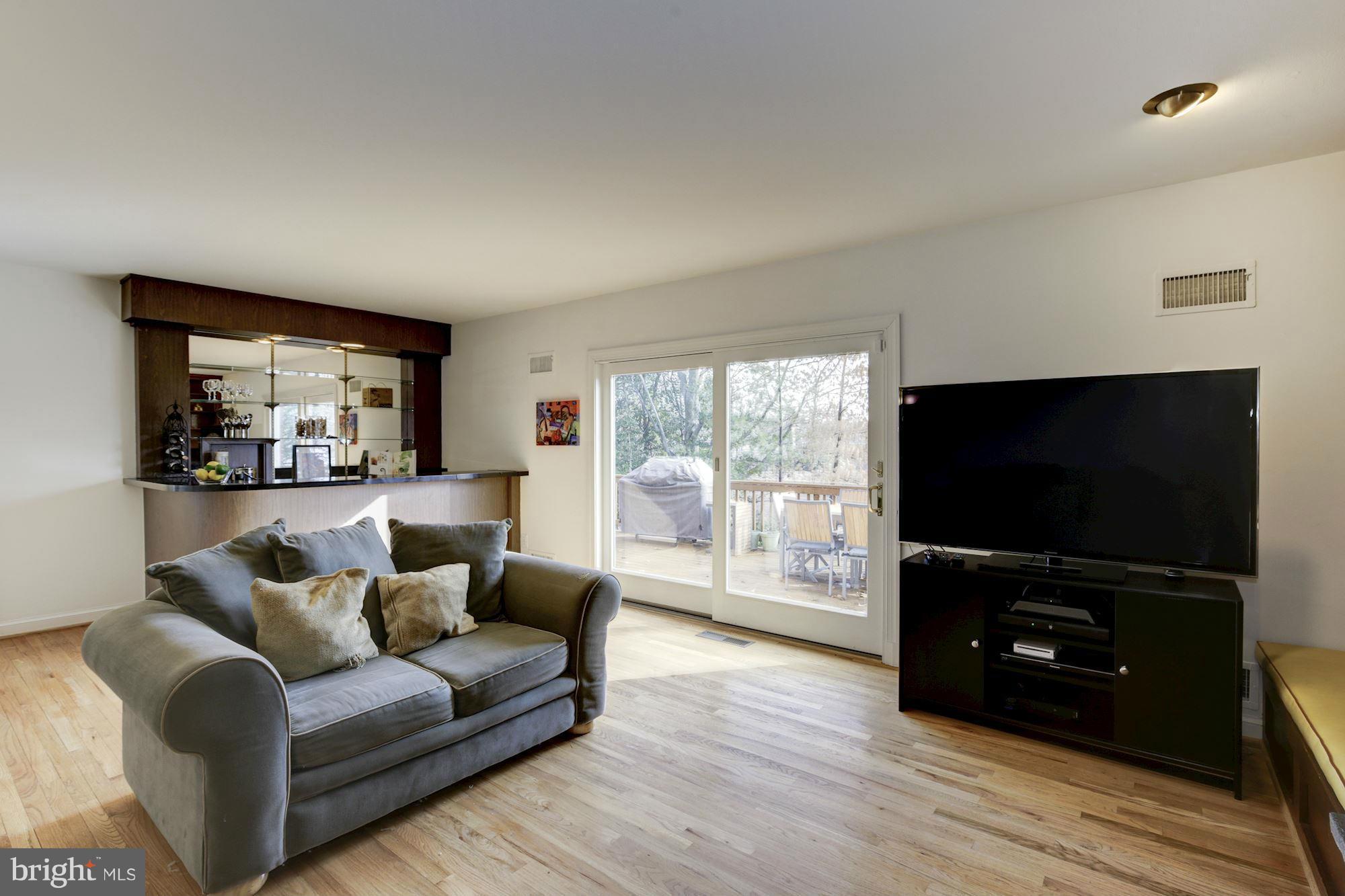 6308 Lenox Road Bethesda, MD 20817 - Photo 15 of 30 a living room with furniture and a flat screen tv