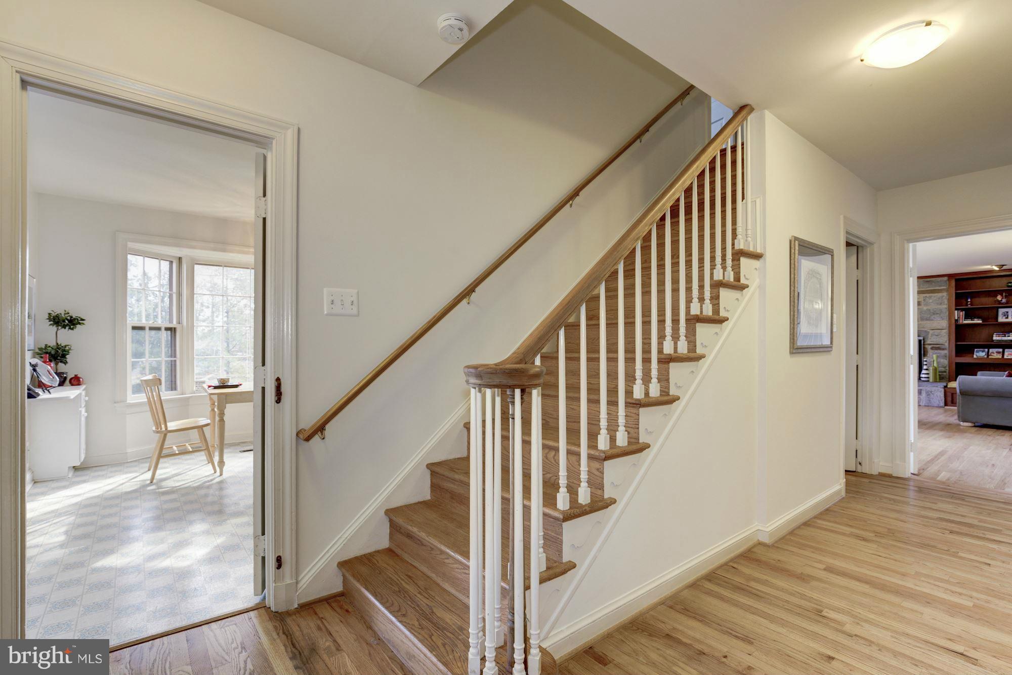 6308 Lenox Road Bethesda, MD 20817 - Photo 16 of 30 a view of staircase with wooden floor and a rug