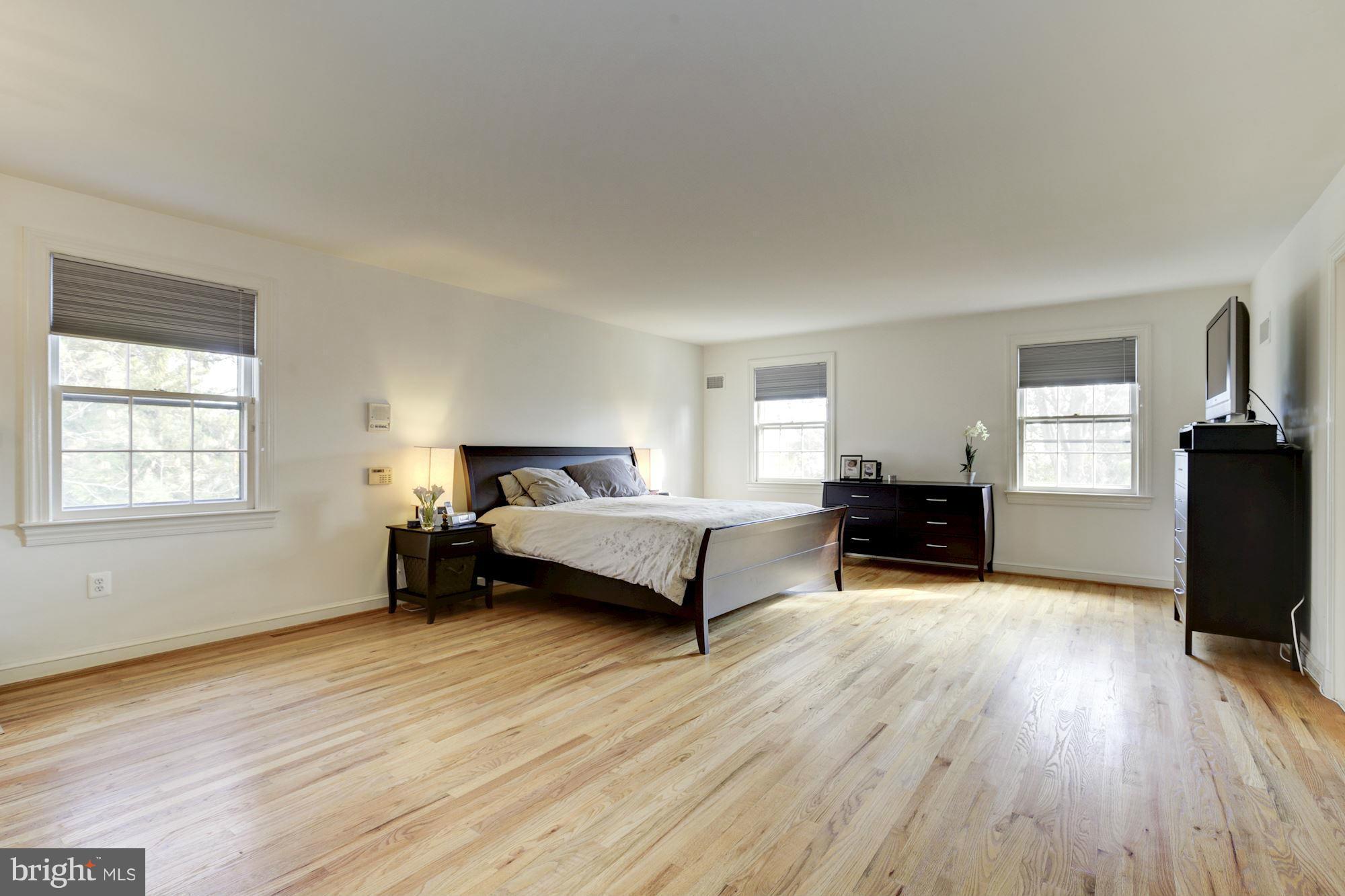 6308 Lenox Road Bethesda, MD 20817 - Photo 19 of 30 a spacious bedroom with a bed and window