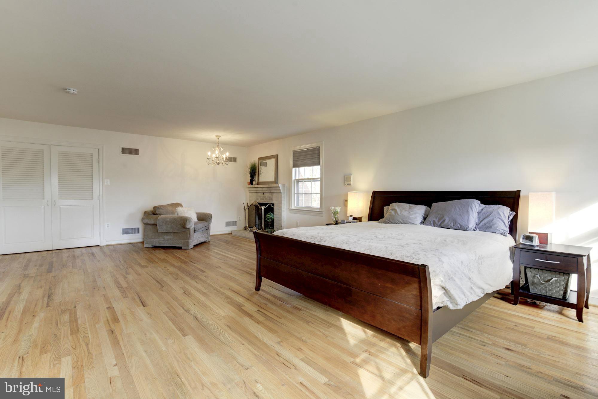 6308 Lenox Road Bethesda, MD 20817 - Photo 20 of 30 a spacious bedroom with a bed and a couch