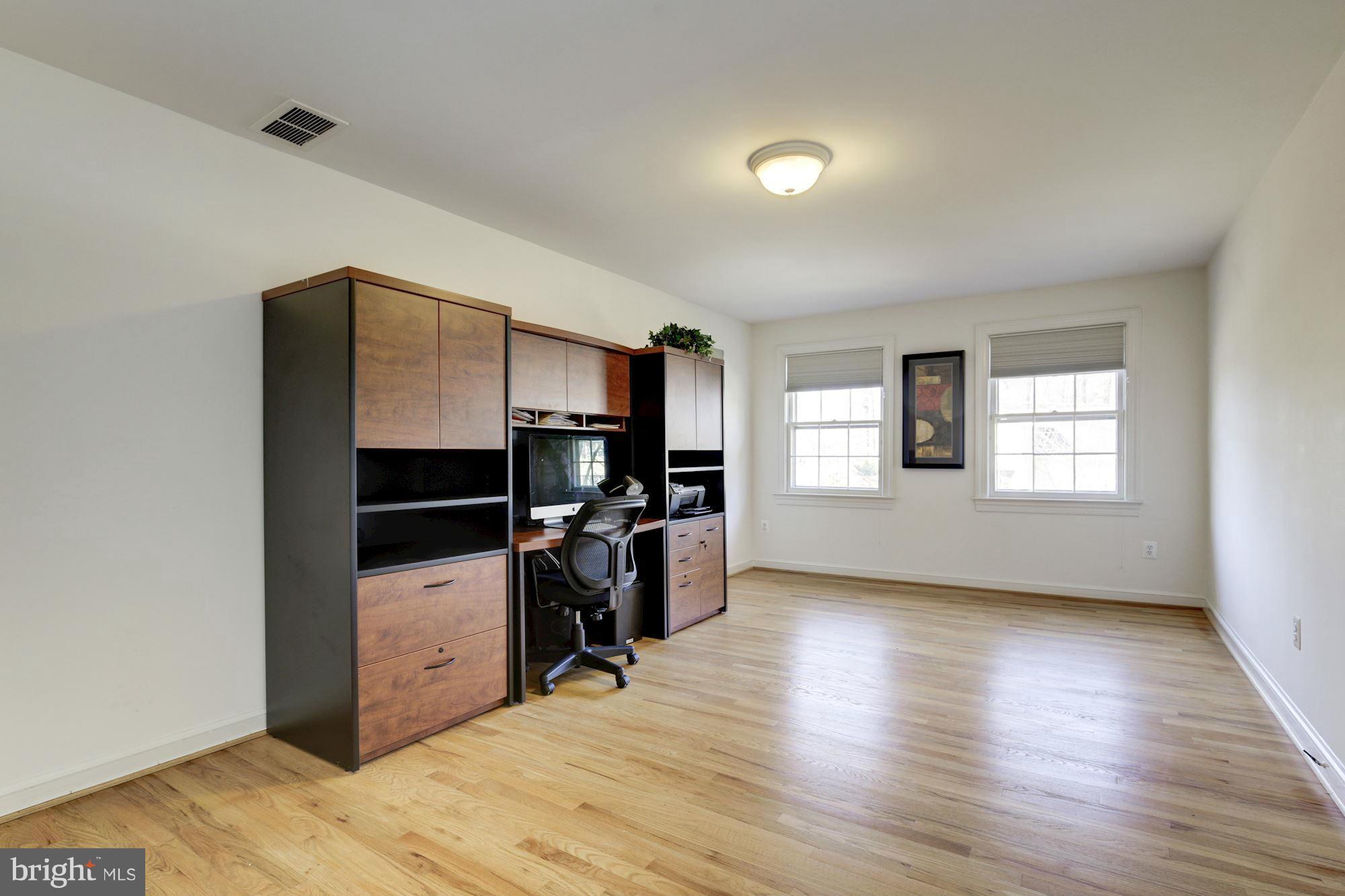 6308 Lenox Road Bethesda, MD 20817 - Photo 22 of 30 a view of a livingroom with furniture and a window
