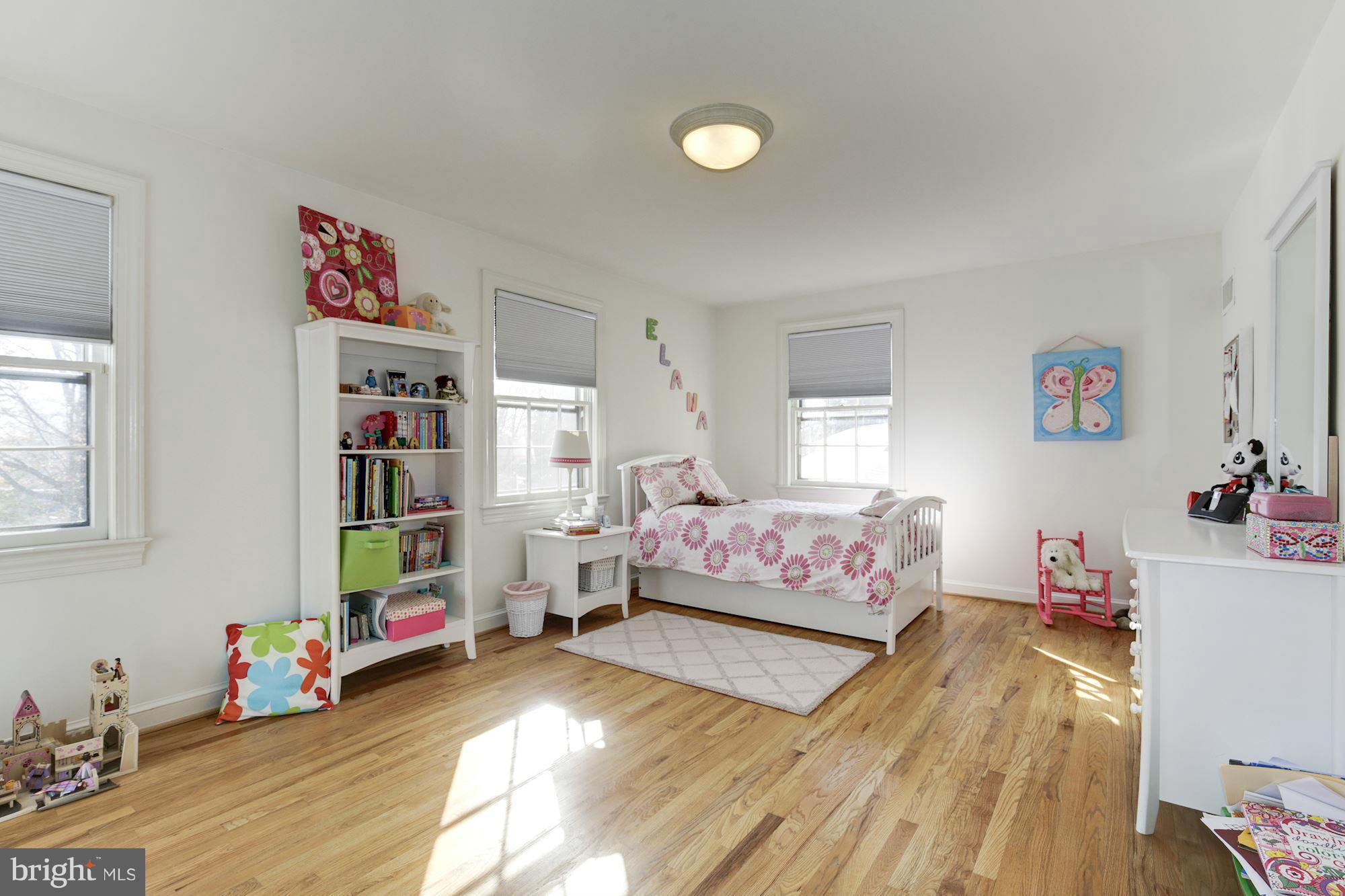 6308 Lenox Road Bethesda, MD 20817 - Photo 23 of 30 a bedroom with bed and wooden floor