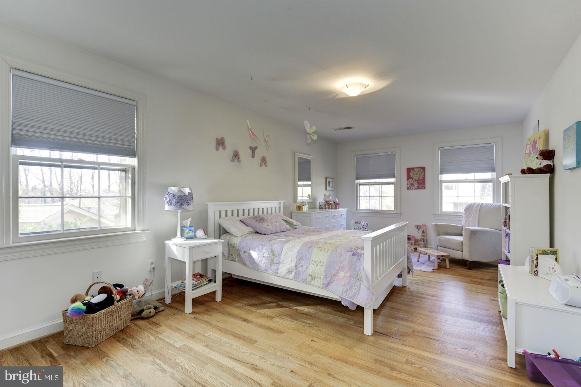 6308 Lenox Road Bethesda, MD 20817 - Photo 24 of 30 a bedroom with a bed and wooden floor