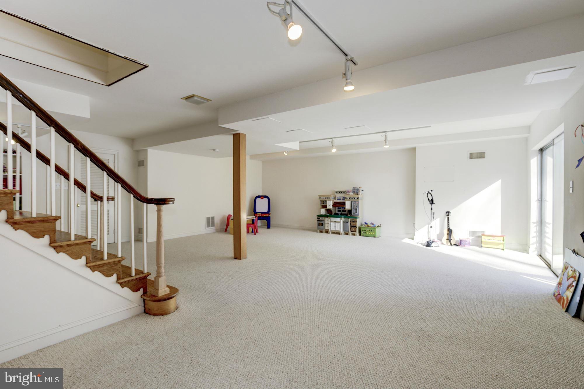 6308 Lenox Road Bethesda, MD 20817 - Photo 26 of 30 a view of an empty room with stairs