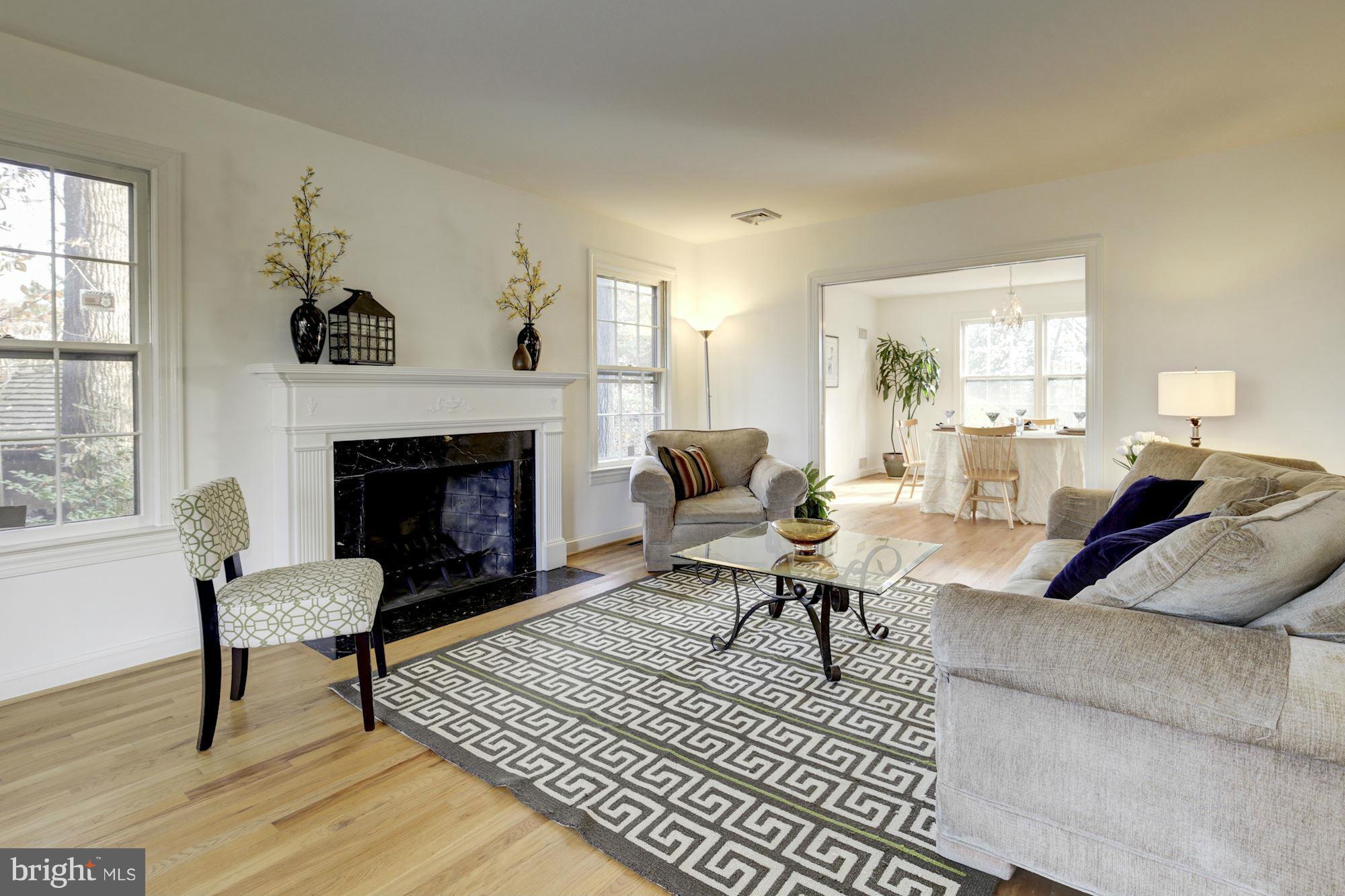 6308 Lenox Road Bethesda, MD 20817 - Photo 5 of 30 a living room with furniture and a fireplace