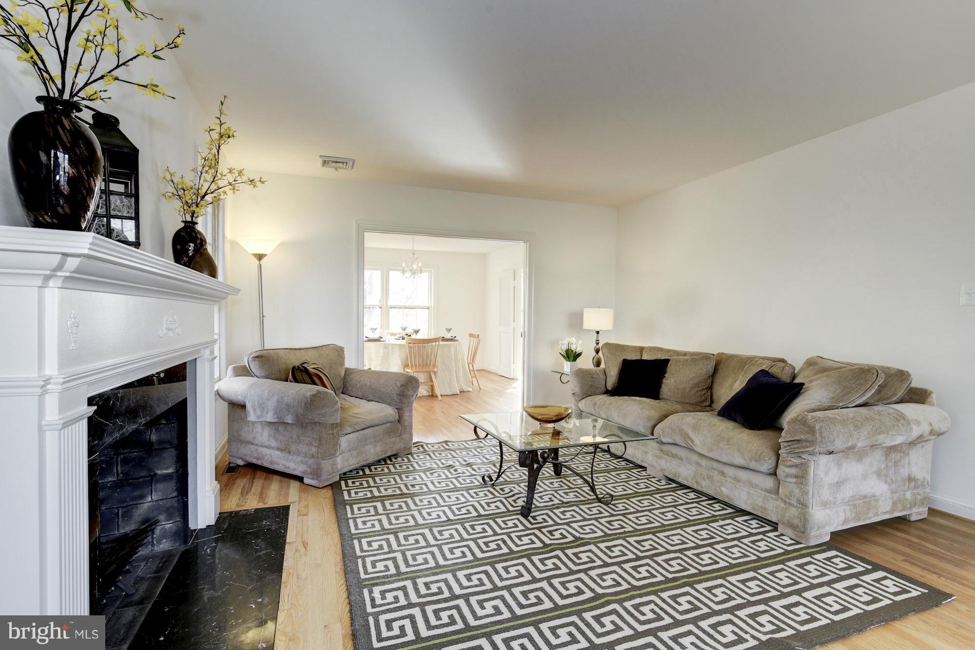 6308 Lenox Road Bethesda, MD 20817 - Photo 6 of 30 a living room with furniture and a fireplace