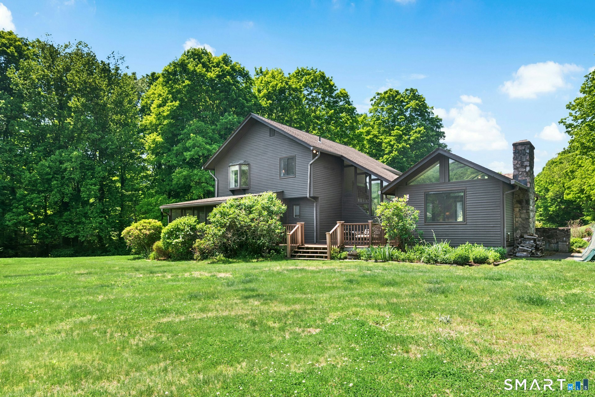 127 Huntingtown Road Newtown, CT 06470 - Photo 27 of 38 a view of a house with garden and yard
