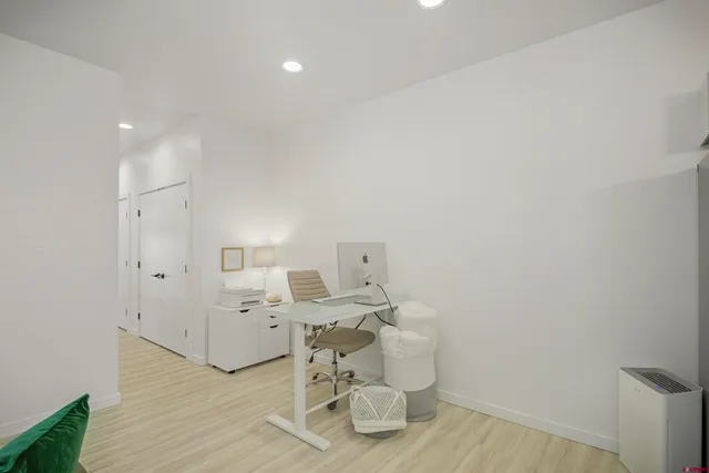 a kitchen with a sink and a refrigerator