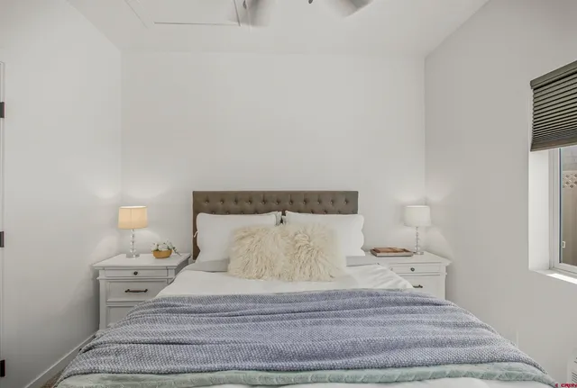 a bedroom with a bed and closet