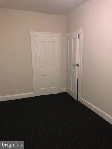 a view of room with window and hardwood floor