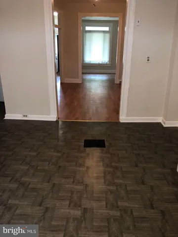 a view of an empty room with windows