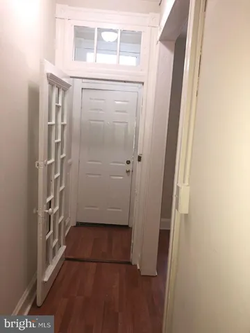 a view of entryway with wooden floor