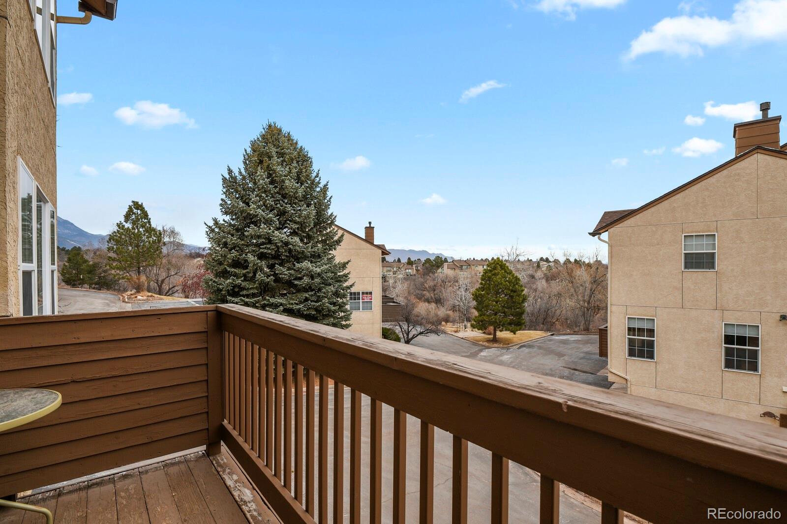 3244 Capstan Way Colorado Springs, CO 80906 - Photo 26 of 37 a view of a balcony with furniture and a mountain view