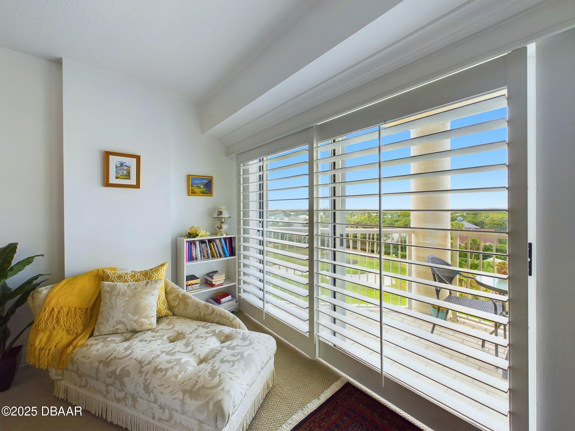 4670 Links Village Drive, Unit C601 Ponce Inlet, FL 32127 - Photo 22 of 68 a living room with furniture and a window