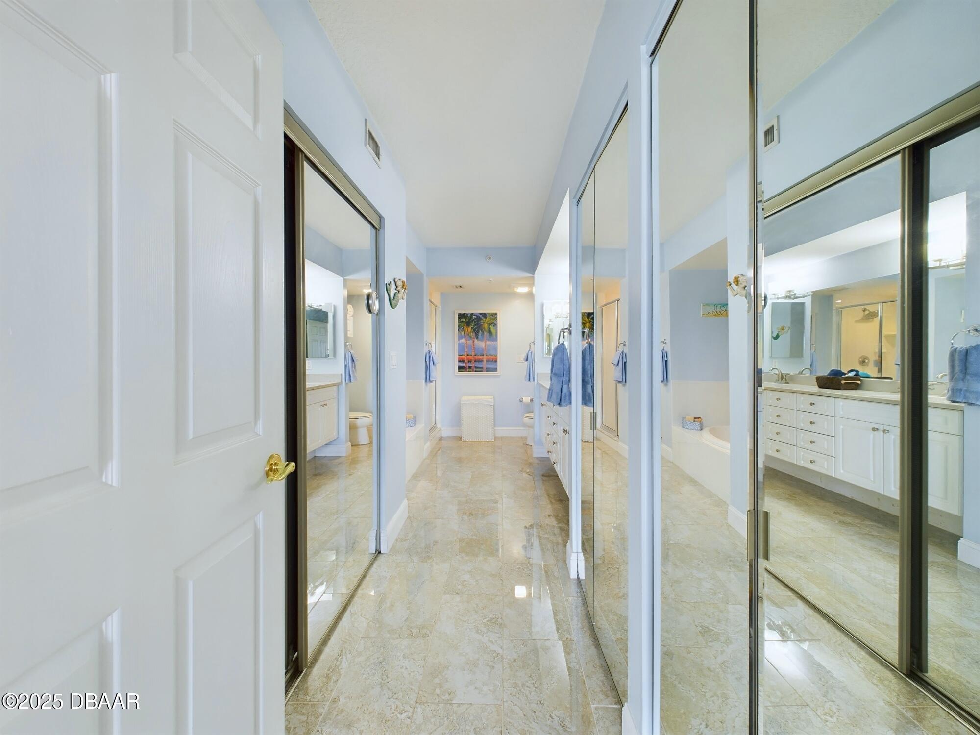 4670 Links Village Drive, Unit C601 Ponce Inlet, FL 32127 - Photo 24 of 68 a view of a hallway with wooden floor and living room